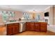 Spacious kitchen with wood cabinets, stainless steel appliances, and a large center island at 6355 Marlow Dr, Cumming, GA 30041