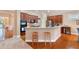 Modern kitchen with stainless steel appliances, breakfast bar, and ample counter space at 6355 Marlow Dr, Cumming, GA 30041
