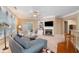 Cozy living room features a fireplace, built-in shelves, comfortable seating, and plenty of natural light at 6355 Marlow Dr, Cumming, GA 30041