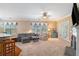 Bright living room with a fireplace, comfortable seating, french doors, and ample natural light at 6355 Marlow Dr, Cumming, GA 30041