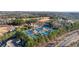 Aerial view of the tennis courts, surrounded by lush trees with easy access to the main road at 6355 Marlow Dr, Cumming, GA 30041