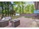 Spacious backyard deck with comfortable outdoor seating, perfect for relaxing and entertaining in a serene setting at 2079 Nancy Se Cir, Smyrna, GA 30080