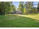 Expansive green backyard with mature trees and lush lawn at 2079 Nancy Se Cir, Smyrna, GA 30080