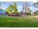 Large, lush backyard with mature trees and a well-maintained lawn at 2079 Nancy Se Cir, Smyrna, GA 30080