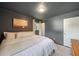 Cozy bedroom with dark blue walls, a king-size bed, and an ensuite bathroom at 2079 Nancy Se Cir, Smyrna, GA 30080
