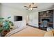 Spacious bedroom with a mounted TV, a workspace, and a large house plant at 2079 Nancy Se Cir, Smyrna, GA 30080