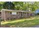 Well-maintained home with a brick exterior, mature landscaping, and a welcoming front yard, showcasing curb appeal at 2079 Nancy Se Cir, Smyrna, GA 30080
