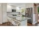 Modern kitchen with white cabinets, stainless steel appliances, granite countertops, and an island with seating at 2079 Nancy Se Cir, Smyrna, GA 30080