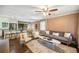 Inviting open concept living room featuring hardwood floors, neutral color palette and seamless flow to the kitchen and dining area at 2079 Nancy Se Cir, Smyrna, GA 30080