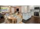 Open-concept living room with a dining area, an island, and abundant natural light from the large windows at 2079 Nancy Se Cir, Smyrna, GA 30080