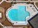 Stunning aerial view of the community pool featuring ample seating and a unique clover shape at 4065 Holland Grove Rd, Lawrenceville, GA 30044