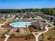 Beautiful aerial view of the neighborhood featuring a pool, playground, and meticulously maintained landscaping at 4065 Holland Grove Rd, Lawrenceville, GA 30044