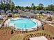 The community clubhouse features a large pool, plentiful lounge seating, and a covered area for relaxation at 4065 Holland Grove Rd, Lawrenceville, GA 30044