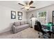 Bedroom with ceiling fan, and a window providing natural light over a study area at 4065 Holland Grove Rd, Lawrenceville, GA 30044
