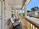 Charming brick front porch with rocking chairs, offering a relaxing outdoor space at 4065 Holland Grove Rd, Lawrenceville, GA 30044