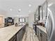 Modern kitchen features granite countertops, stainless steel appliances, and an open layout for easy living at 4065 Holland Grove Rd, Lawrenceville, GA 30044