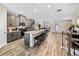 Bright, open kitchen with gray cabinets, a large island with seating, and modern appliances at 4065 Holland Grove Rd, Lawrenceville, GA 30044
