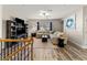 Open concept living room with wood floors, a ceiling fan, lots of natural light, and modern decor at 4065 Holland Grove Rd, Lawrenceville, GA 30044