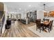 Spacious living area boasts hardwood floors, lots of light and seamlessly connects to the kitchen and dining area at 4065 Holland Grove Rd, Lawrenceville, GA 30044
