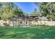 A spacious, grassy backyard features a fenced perimeter and access to the house through a back door at 715 Cowan Rd, Covington, GA 30016