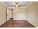 Spacious bedroom featuring wood flooring and neutral walls, creating a serene atmosphere at 715 Cowan Rd, Covington, GA 30016