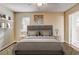 Staged bedroom with a neutral color palette, contemporary decor, and a ceiling fan at 715 Cowan Rd, Covington, GA 30016