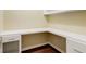 Cozy office nook with built-in desk and shelving, perfect for a home workspace at 715 Cowan Rd, Covington, GA 30016