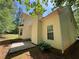 Exterior back of the property with a side patio at 99 Ashtonbrook Dr, Mcdonough, GA 30252