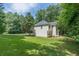 Two-story home features a large backyard with mature trees at 99 Ashtonbrook Dr, Mcdonough, GA 30252