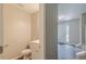 Half bathroom with white toilet and vanity plus neutral paint at 99 Ashtonbrook Dr, Mcdonough, GA 30252