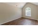 Bedroom with arched window and wood-look flooring at 99 Ashtonbrook Dr, Mcdonough, GA 30252