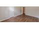 Bedroom with wood-look flooring and view into closet at 99 Ashtonbrook Dr, Mcdonough, GA 30252