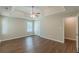 Spacious bedroom with tray ceiling, ceiling fan and wood-look flooring at 99 Ashtonbrook Dr, Mcdonough, GA 30252