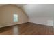 Large bonus room with natural light and hardwood flooring at 99 Ashtonbrook Dr, Mcdonough, GA 30252