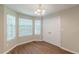 Cozy breakfast nook with bright windows and stylish light fixture at 99 Ashtonbrook Dr, Mcdonough, GA 30252