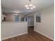 Lovely dining area with modern lighting, half-wall and neutral paint colors at 99 Ashtonbrook Dr, Mcdonough, GA 30252