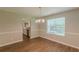 Dining area features a view into the kitchen, new floors, and natural light at 99 Ashtonbrook Dr, Mcdonough, GA 30252