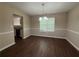 Dining room showcasing modern light fixture and hardwood flooring at 99 Ashtonbrook Dr, Mcdonough, GA 30252