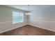 Dining area featuring wood-look floors, neutral paint, and a chandelier at 99 Ashtonbrook Dr, Mcdonough, GA 30252