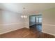 Bright dining space featuring chandelier lighting and wood-look floors at 99 Ashtonbrook Dr, Mcdonough, GA 30252
