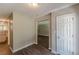 Bright and open foyer featuring hardwood floors and neutral walls, and an open archway at 99 Ashtonbrook Dr, Mcdonough, GA 30252