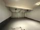 Spacious two-car garage with an epoxy-coated floor and two overhead doors with automatic openers at 99 Ashtonbrook Dr, Mcdonough, GA 30252