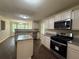 Kitchen with stainless steel appliances, island, and granite countertops at 99 Ashtonbrook Dr, Mcdonough, GA 30252