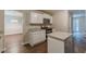 Bright kitchen with stainless steel appliances, granite countertops, and a kitchen island at 99 Ashtonbrook Dr, Mcdonough, GA 30252