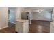 Bright kitchen features granite countertops, stainless steel appliances, and wood flooring at 99 Ashtonbrook Dr, Mcdonough, GA 30252