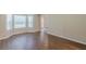 Bright living room with new wood-look flooring and large windows at 99 Ashtonbrook Dr, Mcdonough, GA 30252