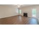 Spacious living room with a cozy fireplace and access to the backyard at 99 Ashtonbrook Dr, Mcdonough, GA 30252