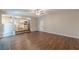 A generous living room boasts an open floor plan with hardwood floors and natural lighting at 99 Ashtonbrook Dr, Mcdonough, GA 30252
