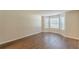 Inviting living space features wood-look floors, lots of natural light at 99 Ashtonbrook Dr, Mcdonough, GA 30252