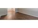 Spacious living area with sleek wood-look floors and natural light at 99 Ashtonbrook Dr, Mcdonough, GA 30252